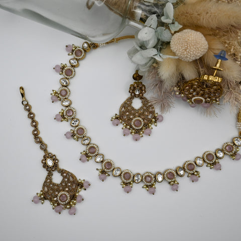 Elise- Baby pink polki stone set with matching earrings and mangtika