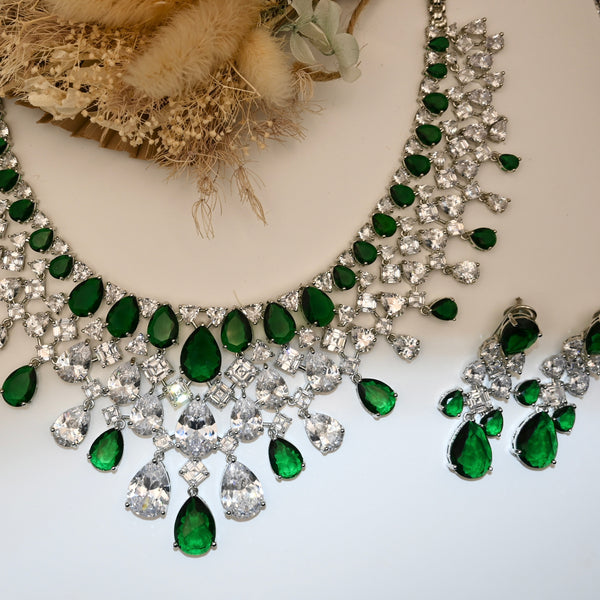 JANA- Clear crystal and emerald green coloured set in silver polish with earrings