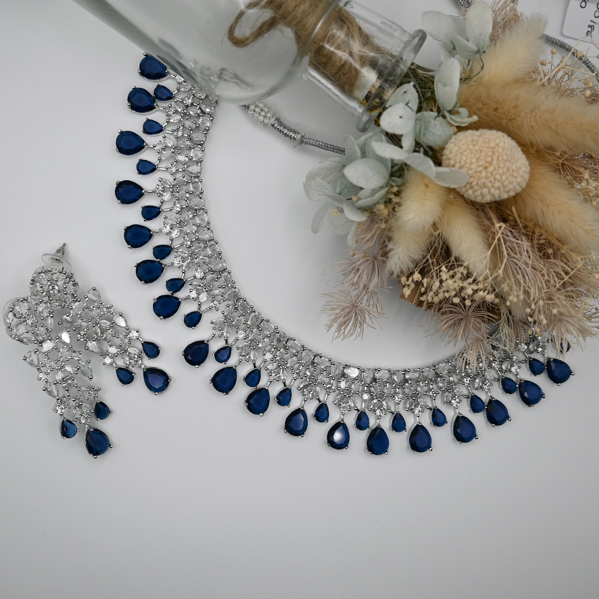 Wlowen- A Cubic Ziconia diamond stone necklace with earrings and nave blue stone