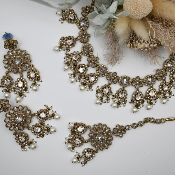 Kavia- necklace, earrings and mangtika with Polki clear stones and mehndi coloured plating
