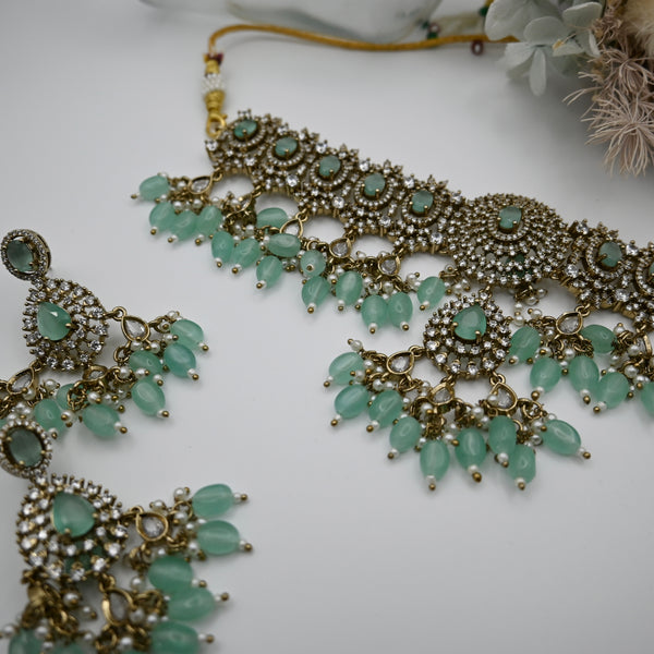 Leocadia- heavy CZ choker with mint green monalisa stone and matching earrings