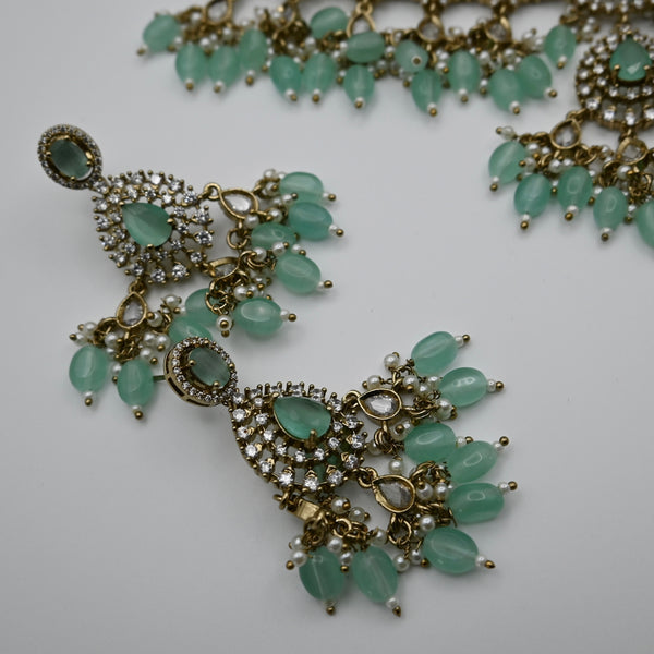 Leocadia- heavy CZ choker with mint green monalisa stone and matching earrings