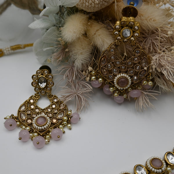 Elise- Baby pink polki stone set with matching earrings and mangtika