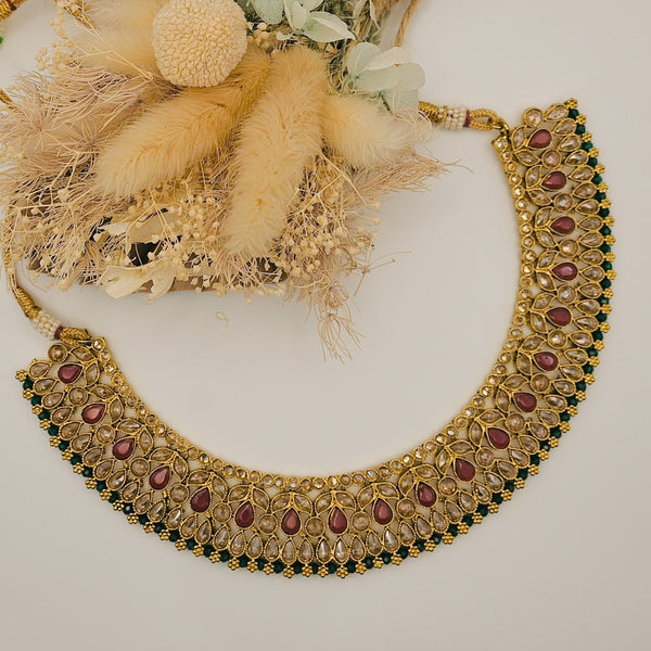 NAJLA- polki stone necklace earrings and mangtika set with maroon and green details