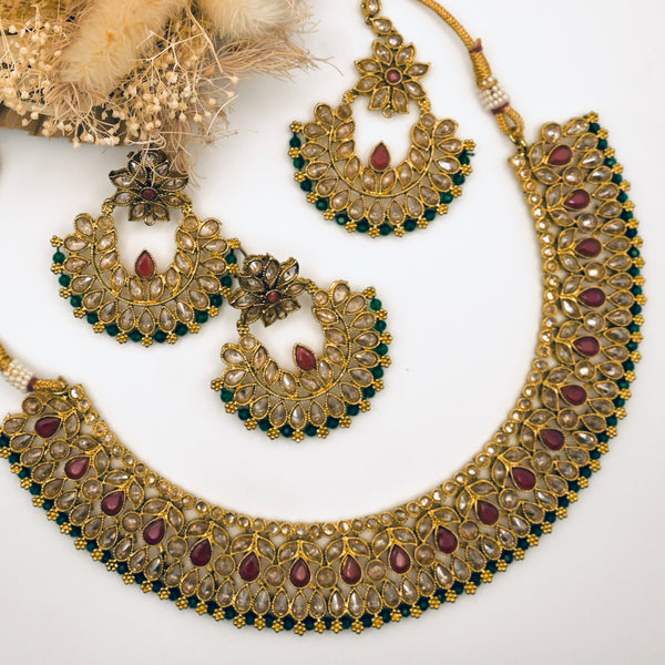 NAJLA- polki stone necklace earrings and mangtika set with maroon and green details